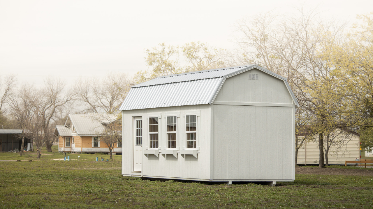 white gambrel style portable building